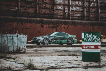 Black Car, Factory Background – Professional Vehicle Photography