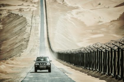 Black SUV Driving on a Road, Candid Moment – Professional Vehicle Photography