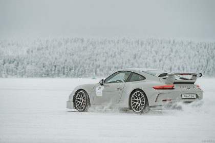 Black Car Driving on a Snowy Surface – Professional Vehicle Photography
