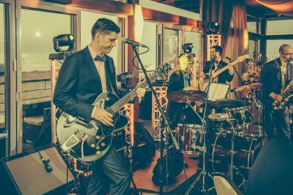 Event Photography, Man with Guitar – Conference Photography