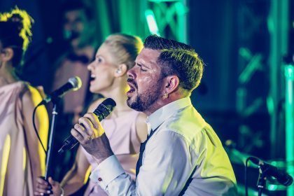 Man with Microphone, Event Photography – Professional Event Reportage