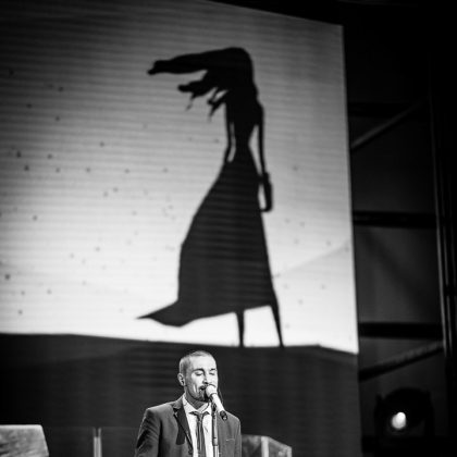 Man in Suit Speaking on Stage – Conference Photography
