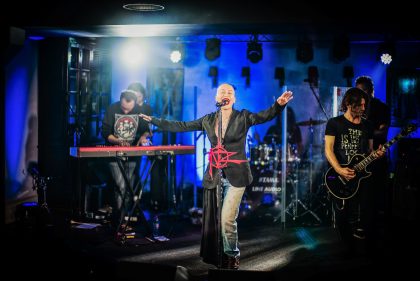 Musician Playing Guitar on Stage – Conference Photography