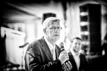 Man in Suit Speaking at Event, Conference Photograph – Business Event Image