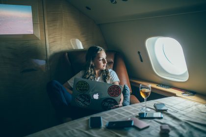 Child Sitting on a Sofa Reading a Book – Child Lifestyle Portrait