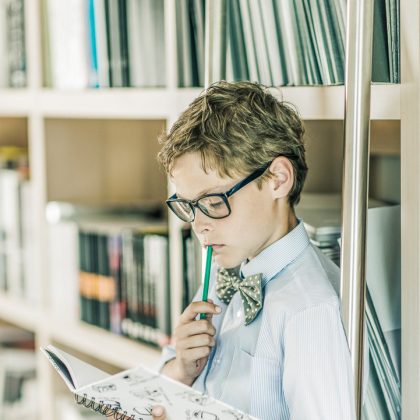 Boy Reading a Book, Arranged in a Home Setting – Children's Photography Portfolio