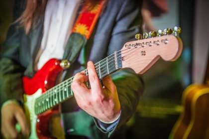 Musician's Hand Playing on Stage – Stage Photography