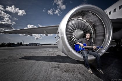 Musician with Guitar, Black-and-White Portrait – Stage Photography