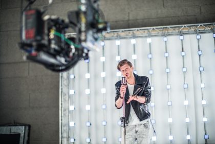 Musician on Stage, Black Leather Jacket – Concert Photography Portfolio