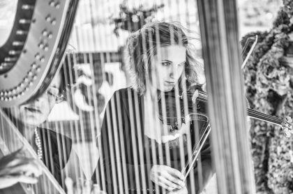 Musician Playing Violin in Concert Hall – Music Photography