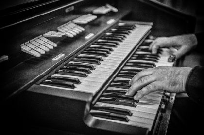 Musician's Hands Playing Keyboard Keys – Concert Photography Portfolio