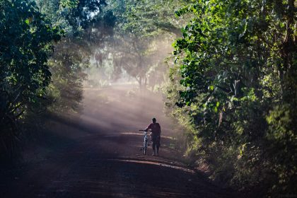 Man with Bicycle in Countryside – Editorial Travel Image