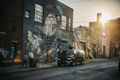 Two People Walking on a City Street – Destination Photography