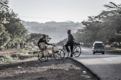 Man with Bicycle, Road – Editorial Travel Image
