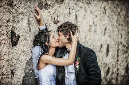 Wedding Photograph: Happy Couple in Garden, Atmospheric Frame – Romantic Wedding Image