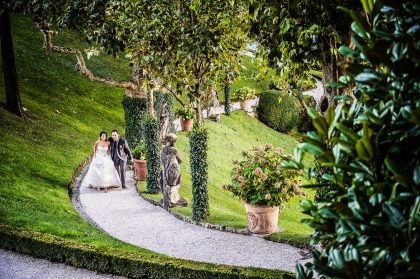 Wedding Photograph: Couple Walking in Garden – Wedding Photography Portfolio